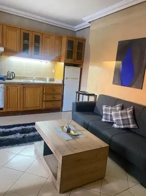 a living room with a couch and a coffee table at superbe appartement à Gueliz in Marrakech