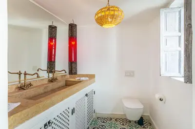 a bathroom with a sink and a toilet at Riad Itri (إتري) Exclusif - Marrocan Breakfast in Marrakech