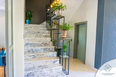 a staircase in a house with potted plants at Villa Boutique Amani in Marrakech