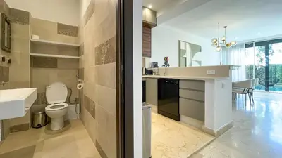 a bathroom with a toilet and a sink and a counter at Villa Atlas piscine chauffée à Marrakech in Marrakech