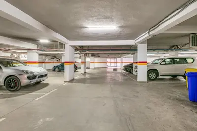 an empty parking garage with cars parked in it at Central Cosy Appartement Avec Piscine in Marrakech