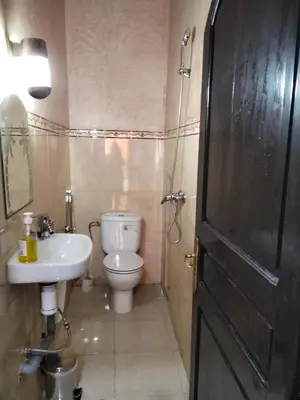 a small bathroom with a toilet and a sink at DAR IJLAL in Marrakech
