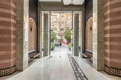 an empty hallway with columns in a building at New! Appartement Diana calme ,Terrasse in Marrakech