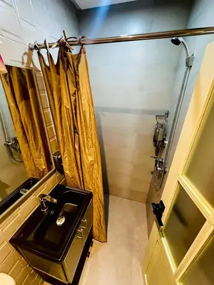a bathroom with a sink and a shower at Riad hotel Cecil in Marrakech