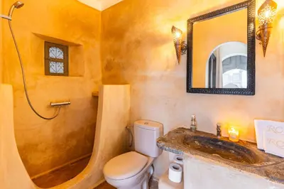 a bathroom with a toilet and a sink and a shower at Riad Coco Marrakech in Marrakech