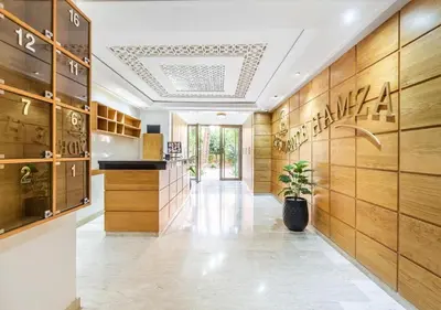 a hallway of a store with wooden walls at TheCasaEdition - Gueliz Apartments in Marrakech