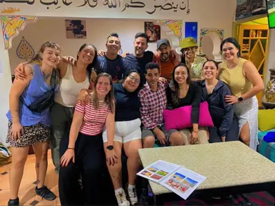 a group of people posing for a picture in a room at Hostel kif kif annex in Marrakech