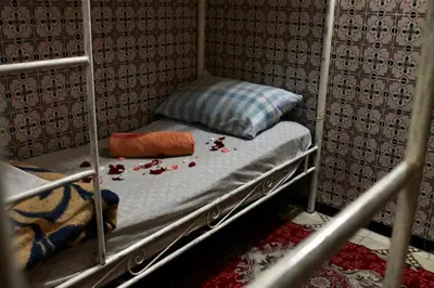 a couple of bunk beds in a room with blood at Hostel kif kif annex in Marrakech