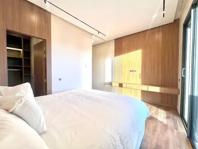 a bedroom with a large white bed and a window at LUXURY Villa Argane 5 BDR -ONLY FAMILYS in Marrakech