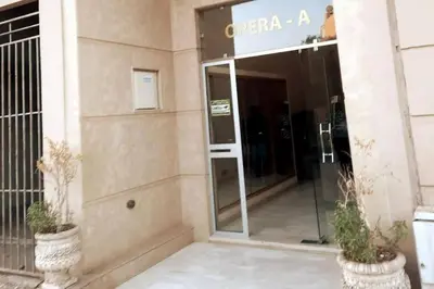 an entrance to an office building with a revolving door at Chic & Cosy au coeur d’hivernage in Marrakech
