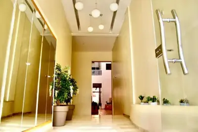 a lobby of a building with potted plants at Chic & Cosy au coeur d’hivernage in Marrakech