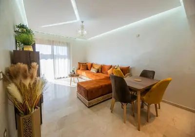 a living room with a couch and a table at Pearl Garden 69 in Marrakech
