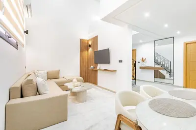 a living room with a couch and a table at New! Duplex de Luxe, Cocon de Confort in Marrakech
