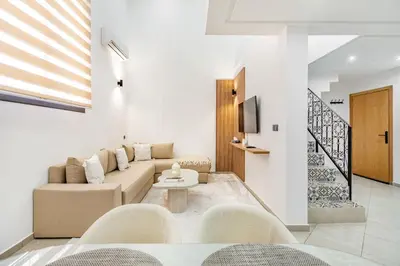 a living room with a couch and a table at New! Duplex de Luxe, Cocon de Confort in Marrakech
