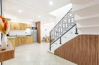 an open kitchen and staircase in a house at New! Duplex de Luxe, Cocon de Confort in Marrakech
