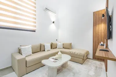 a living room with a couch and a table at New! Duplex de Luxe, Cocon de Confort in Marrakech