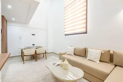 a living room with a couch and a table at New! Duplex de Luxe, Cocon de Confort in Marrakech