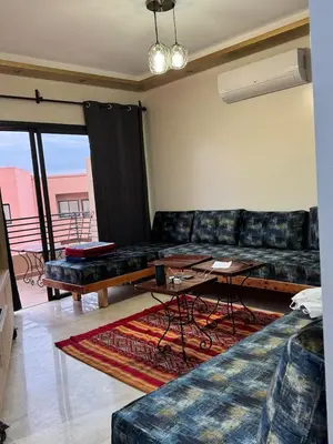 a living room with a couch and a table at A1, Central, Old-City 7Min on feet, good equipped in Geliz, Bab-Dokala, Majorelle, No taxi needed in Marrakech