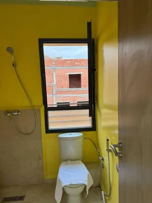 a bathroom with a toilet and a window and a shower at A1, Central, Old-City 7Min on feet, good equipped in Geliz, Bab-Dokala, Majorelle, No taxi needed in Marrakech