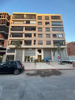 a car parked in front of a large building at A1, Central, Old-City 7Min on feet, good equipped in Geliz, Bab-Dokala, Majorelle, No taxi needed in Marrakech