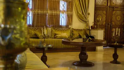 a living room with a couch and a table at Zine Villa Guest House in Marrakech