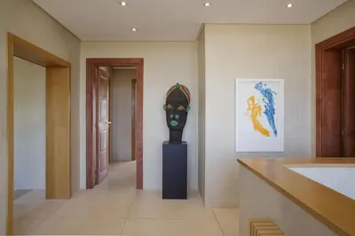 a hallway with a vase in the middle of a room at Villa MISH-MISH in Marrakech