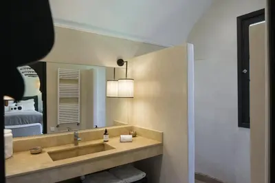 a bathroom with a sink and a mirror at Villa Jennabelle in Marrakech