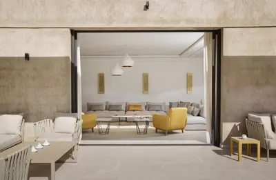 a living room with couches and a table at Villa PEPE in Marrakech