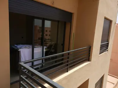 a balcony of a building with a railing and a window at B1 In Center of Marrakech, Geliz-Majorelle, Bab-Dokala, No need for Taxi in Marrakech