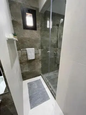 a bathroom with a shower with a glass door at Villa Amèle,calme,Ensoleillé,Piscine,Salle de jeux in Marrakech