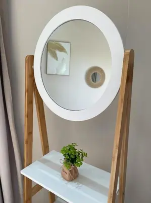 a mirror above a table with a plant on it at Villa Amèle,calme,Ensoleillé,Piscine,Salle de jeux in Marrakech