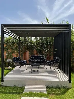 a group of chairs sitting on a patio at Villa Amèle,calme,Ensoleillé,Piscine,Salle de jeux in Marrakech