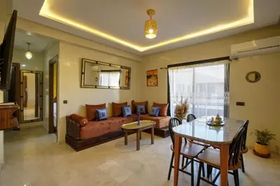 a living room with a couch and a table at Nour 5 el bellar in Marrakech