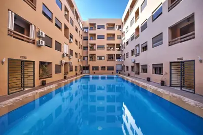 a swimming pool in the middle of a building at Nour 5 el bellar in Marrakech