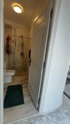 an open door to a bathroom with a shower and a toilet at Riad VIP Bed & Breakfast in Marrakech
