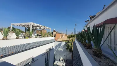 a view from the balcony of a building with plants at Riad VIP Bed & Breakfast in Marrakech