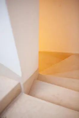 an empty room with stairs and a wooden floor at Cosy Riad in Marrakech