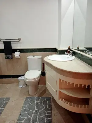 a bathroom with a toilet and a sink at Lovely Marrakech in Marrakech