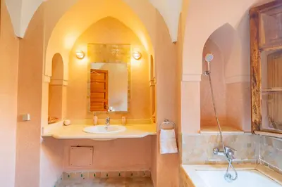 a bathroom with a sink and a mirror at Villa les oliviers in Marrakech