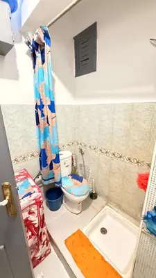 a small bathroom with a toilet and a sink at WOLFY’s Apartment in Marrakech