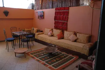 a living room with a couch and a table at kech hostel in Marrakech