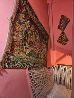 a tapestry hanging on a wall in a room at kech hostel in Marrakech