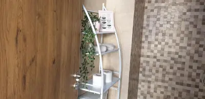 a bathroom with a shelf with a plant on it at Appartement gueliz 2 chambres in Marrakech