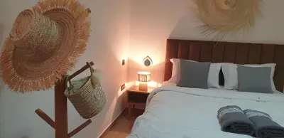 a bedroom with a large bed with a basket on it at Appartement gueliz 30 in Marrakech
