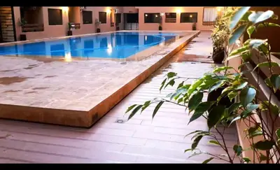 a large swimming pool in a building at Appartement gueliz 30 in Marrakech