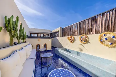 a house with a swimming pool with a fence at Riad Dar Lalla Saadia-Exclusiv-HeatedPool-Breakfast in Marrakech