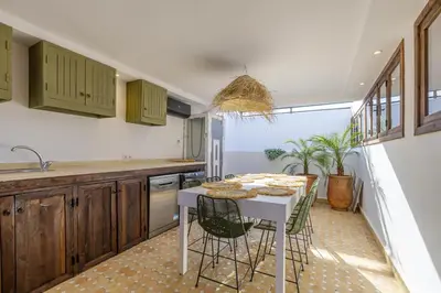 a kitchen with a table and chairs in a room at Riad Dar Lalla Saadia-Exclusiv-HeatedPool-Breakfast in Marrakech