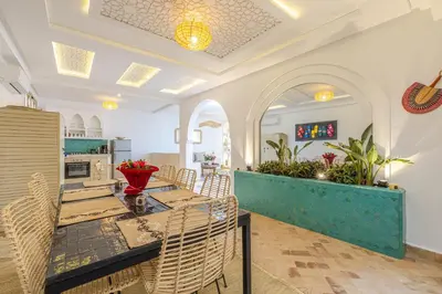 a kitchen and dining room with a table and chairs at Riad Agan Exclusive with New Heated Pool and Breakfast included in Marrakech