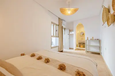 a bedroom with a large bed in a room at Riad Agan Exclusive with New Heated Pool and Breakfast included in Marrakech