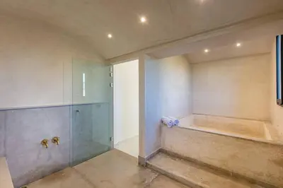 a bathroom with a shower and a glass shower stall at Villa Victoria, piscine Chauffée, sans vis à vis in Marrakech